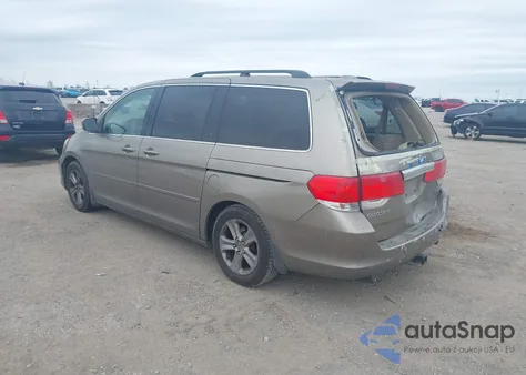 2010 Honda Odyssey Touring z USA, uszkodzony, nr VIN 5FNRL3H90AB047535